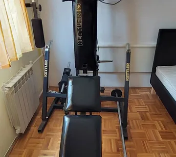 Očuvan Kettler Classic Multi Gym set sa 100kg utega i šipkom - cover