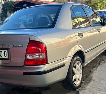 MAZDA 323 SEDAN 1999 god  1.3 benzin REG 1 GOD - cover