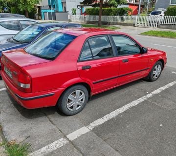 Mazda 323 sedan - cover