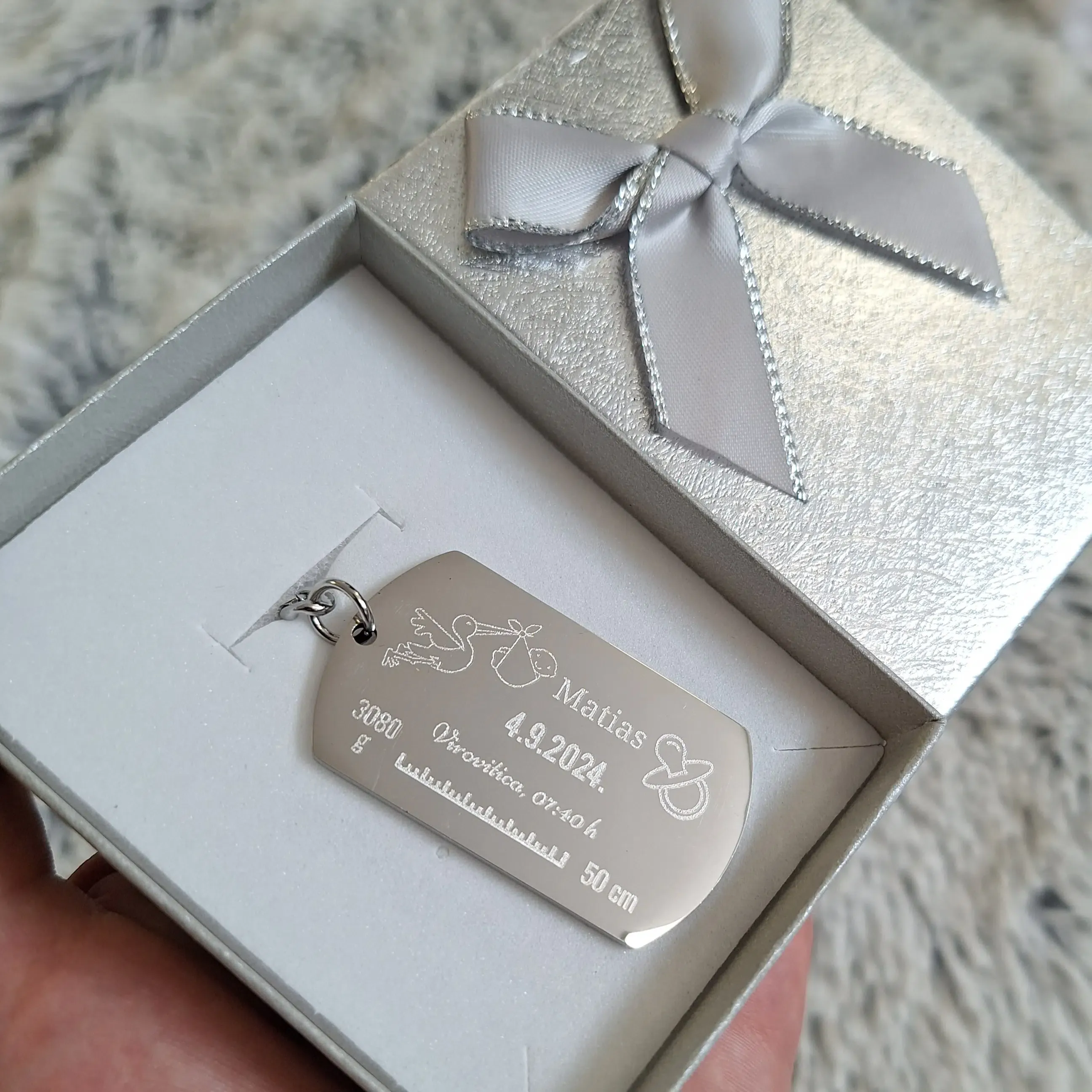 Čelični privjesak za novorođenče - cover