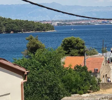 GRAĐEVINSKO ZEMLJIŠTE S PRISTUPNIM PUTEM I POGLEDOM NA MORE - KALI, UGLJAN - cover