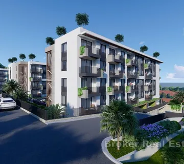 Atraktivan dvosoban apartman u novogradnji s djelomičnim pogledom na more - Makarska