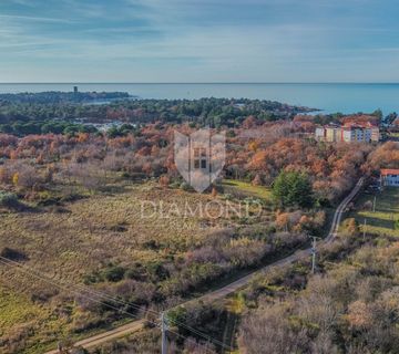 Umag, prostrano građevinsko zemljište 500m od mora - cover