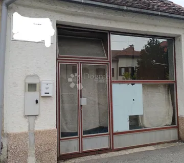 Zemljište s poslovnim prostorom i potencijalom gradnje u strogom centru Đakova-mogućnost zamjene! - Đakovo