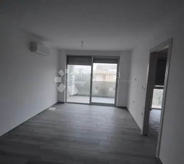Dvosoban stan u novogradnji 1 km od mora, površine 54,47 m2 - cover