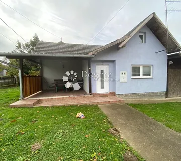 Samostojeća kuća s garažom i velikom okućnicom - cover