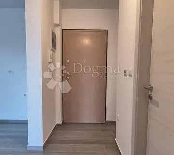 Dvosoban stan u novogradnji 1 km od mora, površine 54,47 m2 - cover