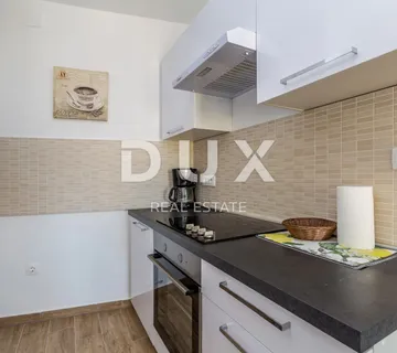 OTOK KRK, NJIVICE - Kuća s apartmanima i poslovnim prostorom - cover