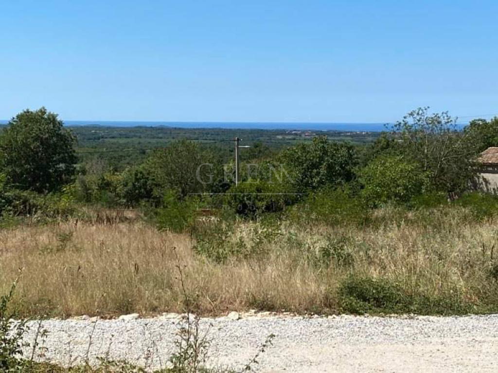 Građevinsko zemljište 12 km od Poreča sa pogledom na more, 659 m2, prodaja - cover