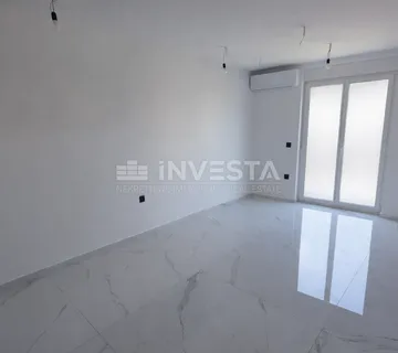 Jednosoban stan s vrtom u novogradnji s uporabnom - cover