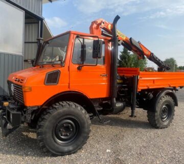 Mercedes Unimog U1450 - kiper s dizalicom Palfinger PK 7000, 1997 god. - cover