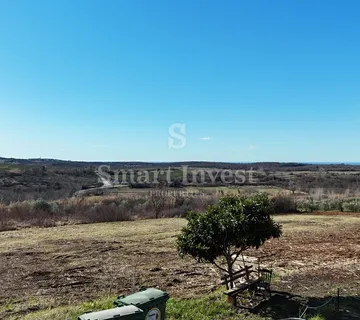 BUJE, građevinsko zemljište od 1302 m2 za kuću, pogled more - cover