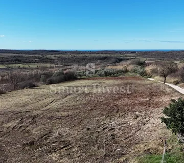 BUJE, građevinsko zemljište od 1036 m2 za kuću, pogled more - cover