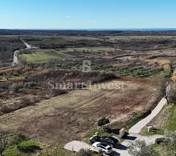 BUJE, građevinsko zemljište od 1036 m2 za kuću, pogled more - cover