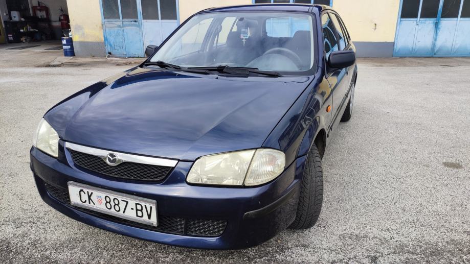 Mazda 323 F 1,4 i Cool - cover