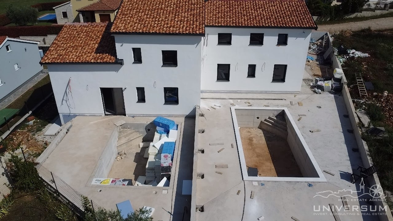 Prodaje se dvojna kuća s bazenom i pogledom na more u Višnjanu - cover