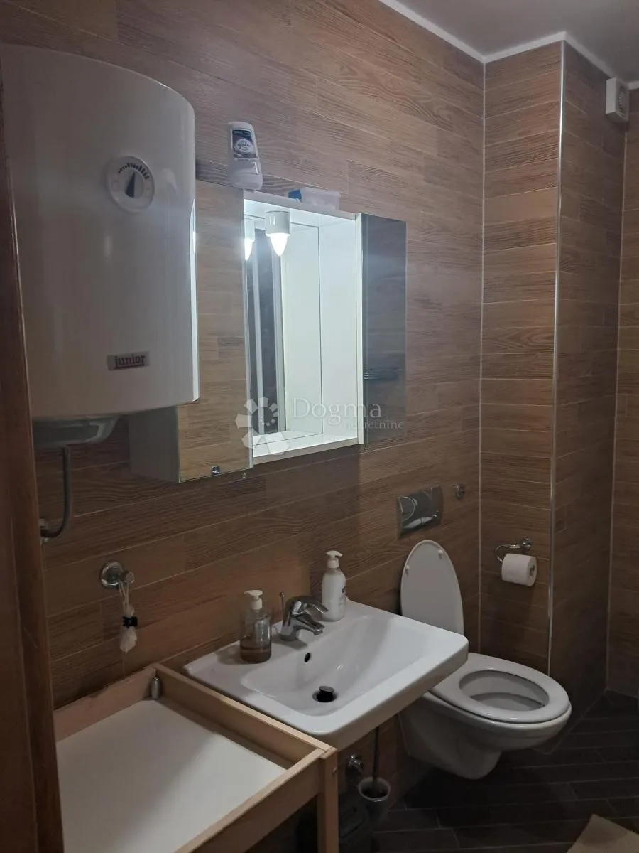novi nekorišten apartman 200m od mora - slika 9