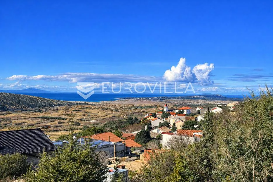 Pag, Kolan, građevinsko zemljište s panoramskim pogledom, 1597 m²
